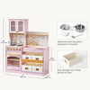 Pink wooden toy kitchen set with floral wallpaper, gold-tone faucet and knobs, storage bins, and included cookware shown in inset images with dimensions labeled on a light gray background.