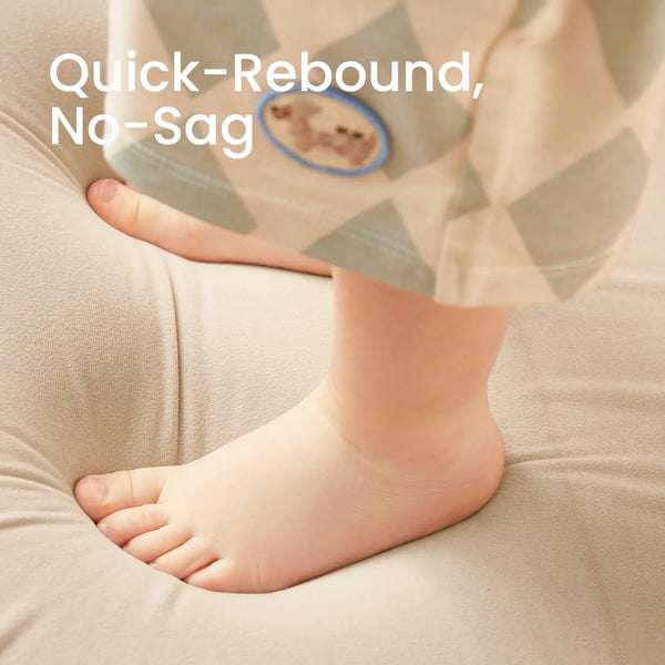 Baby's foot on a soft surface with text 'Quick-Rebound, No-Sag' in the background.