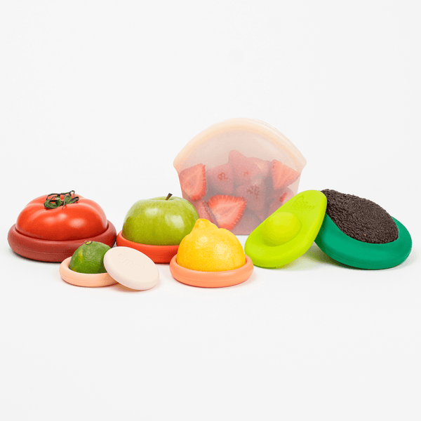 Colorful toy fruits and vegetables on a white background