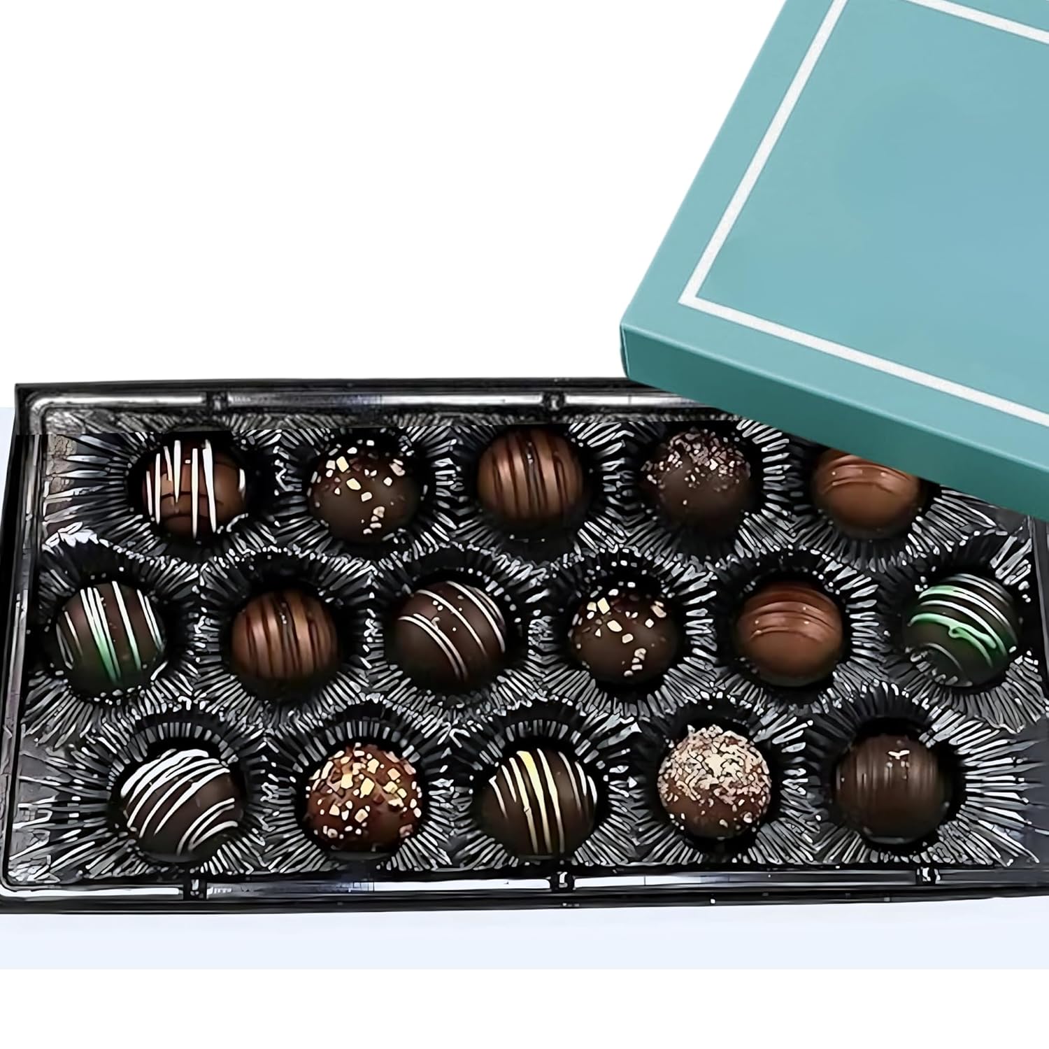 Assorted chocolates in a decorative box with a light blue lid.