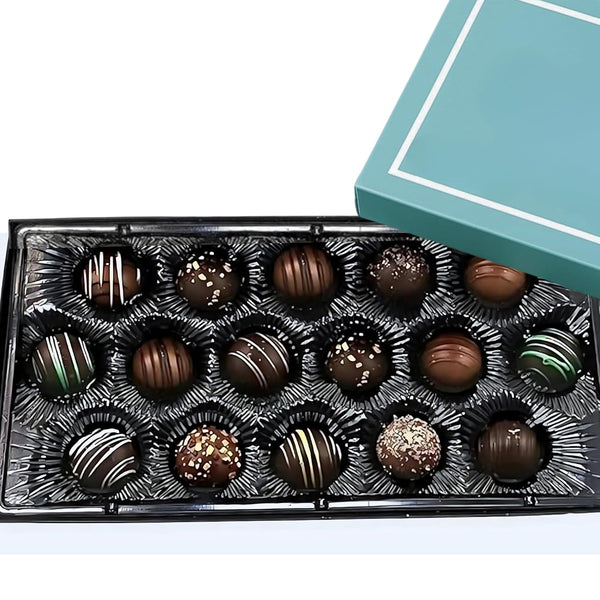Assorted chocolates in a decorative box with a light blue lid.