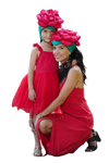Woman and child in matching red dresses with floral headbands on a white background