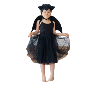 Baby wearing a black bat tutu costume with wings and hat on a white background