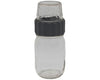 Clear glass bottle with black cap on a white background