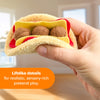 Hand holding a plush toy resembling a hot dog with text about sensory-rich pretend play.