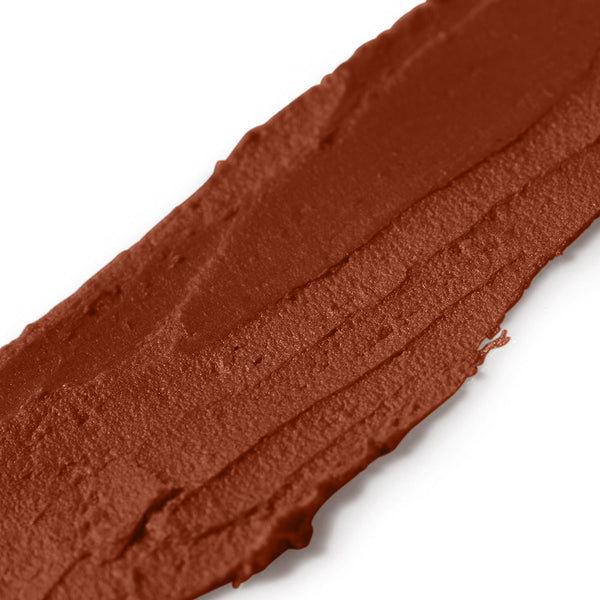 Close-up of a brown makeup swatch on a white background