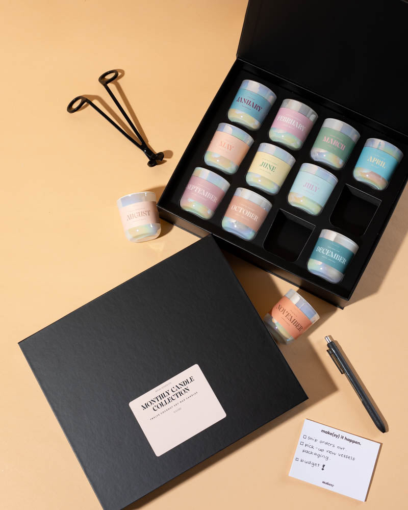 Set of makesy® 2.5oz magnetic candle boxes styled as a monthly candle gift collection