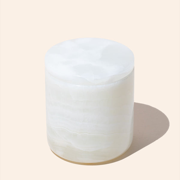 Close-up of 10oz Onyx stone candle jar in natural colour with lid