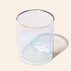 Clear glass candle holder on a beige background