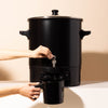makesy® large-capacity candle wax melter positioned in a candle-making studio setup