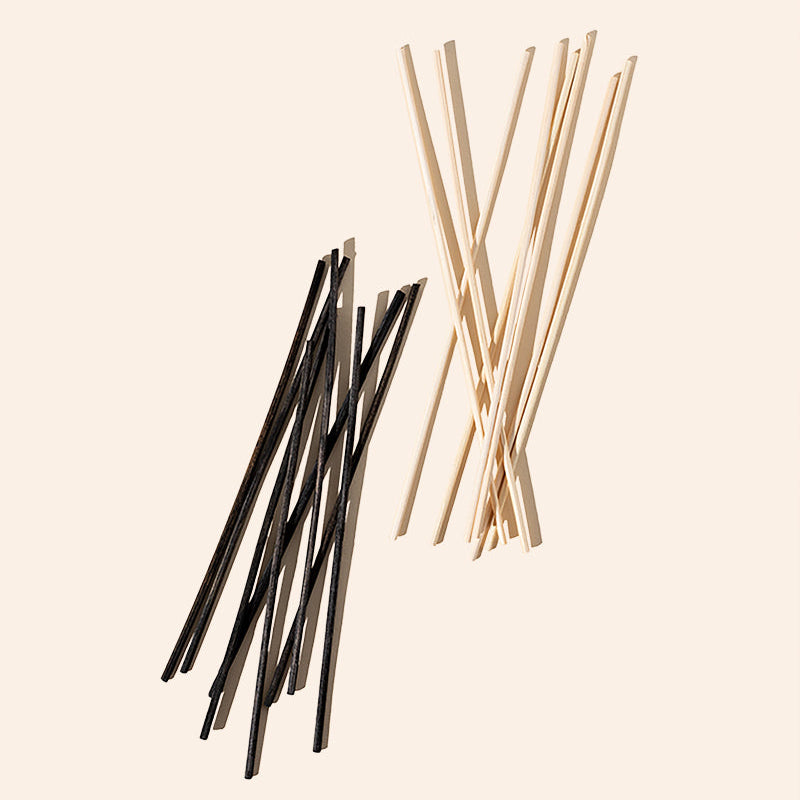 Bundle of natural rattan diffuser reeds in black and natural finish by makesy