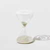 Clear hourglass on a white background
