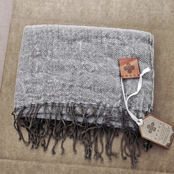 Awana Alpaca Pashmina draped as a shawl, displaying its lightweight natural alpaca and cotton blend fabric