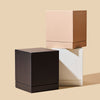 Makesy ivory rigid square candle gift box styled with a 12oz candle in a product lineup