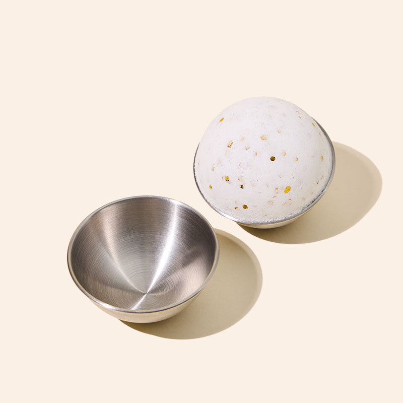 Stainless steel bath bomb mold by makesy producing perfectly round DIY bath bombs
