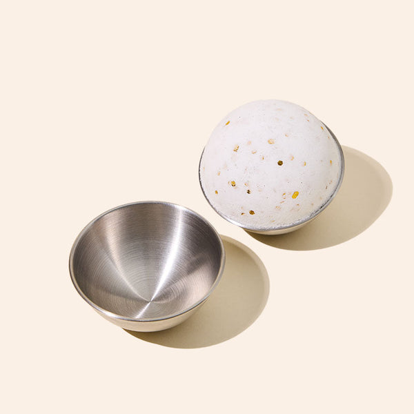 Stainless steel bath bomb mold by makesy producing perfectly round DIY bath bombs