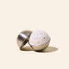 Close-up of stainless steel bath bomb mold showing smooth finish and construction detail