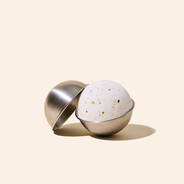 Close-up of stainless steel bath bomb mold showing smooth finish and construction detail