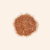 Brown glitter powder on a beige background