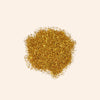 Gold glitter on a beige background