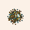 Colorful heart-shaped confetti on a beige background
