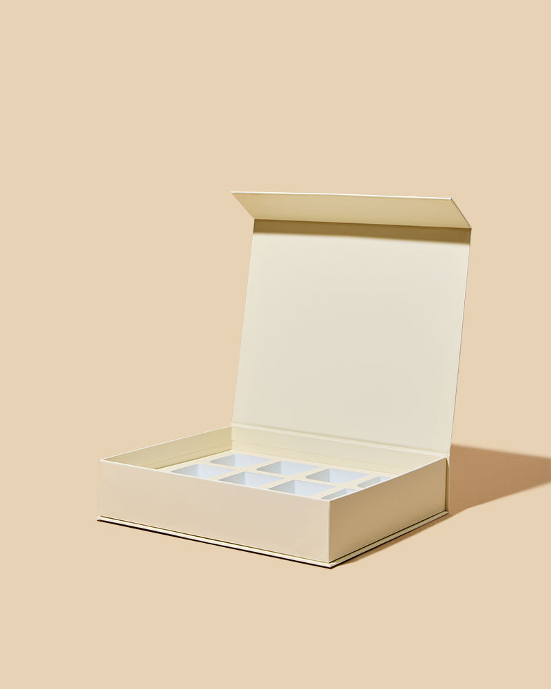 Beige jewelry box with a clear lid on a beige background