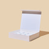 White jewelry box with a clear lid on a beige background