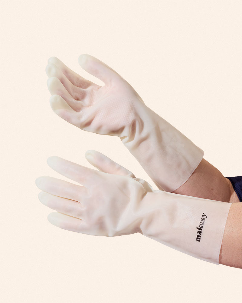 Close-up of makesy cream nitrile gloves designed for soap makers and bath and body crafters