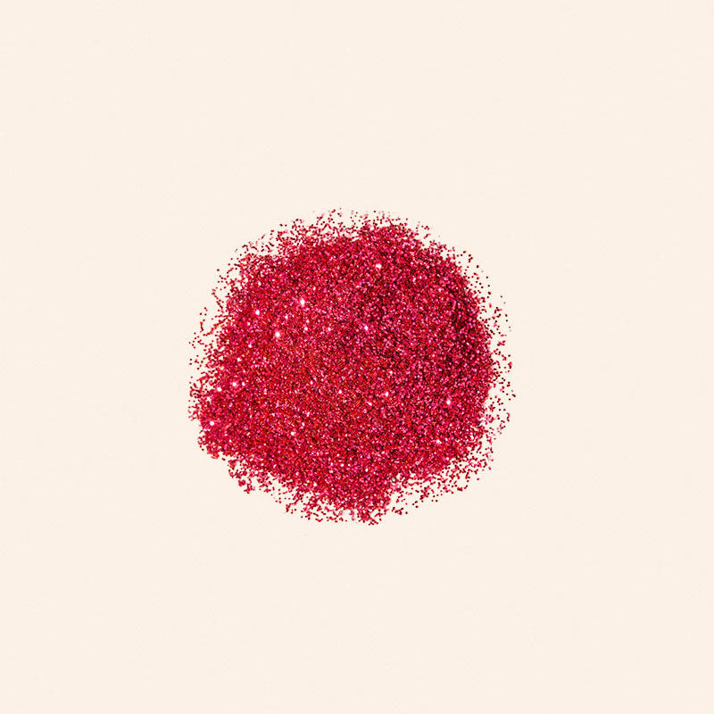 Red glitter on a beige background