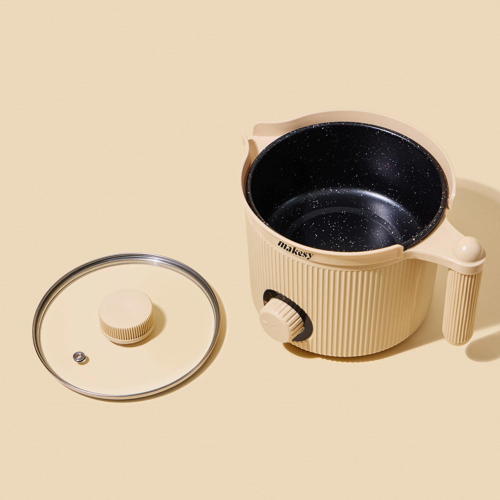 makesy small wax melter styled in a craft workspace alongside candle making supplies