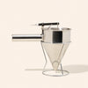 makesy stainless steel candle wax dispenser and stand with 36oz capacity on a clean work surface