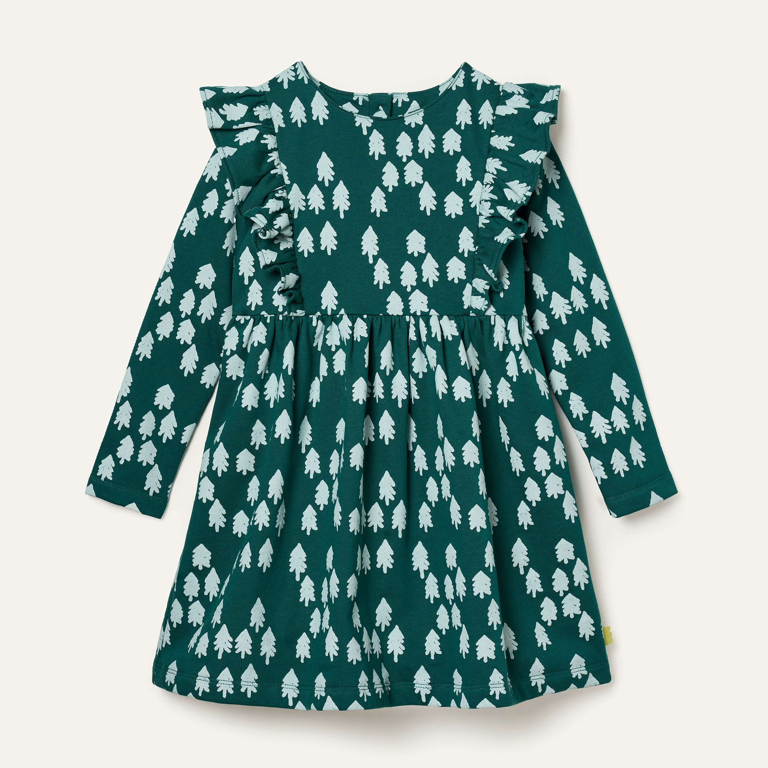 Girl wearing Mon Coeur Snowy Pine Ruffle Dress in recycled organic cotton fleece, front view