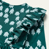Young girl in Mon Coeur Snowy Pine A-line Ruffle Dress, side profile showing relaxed fit