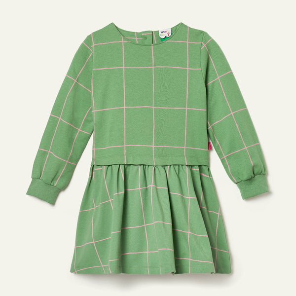 Green dress with pink grid pattern on a white background