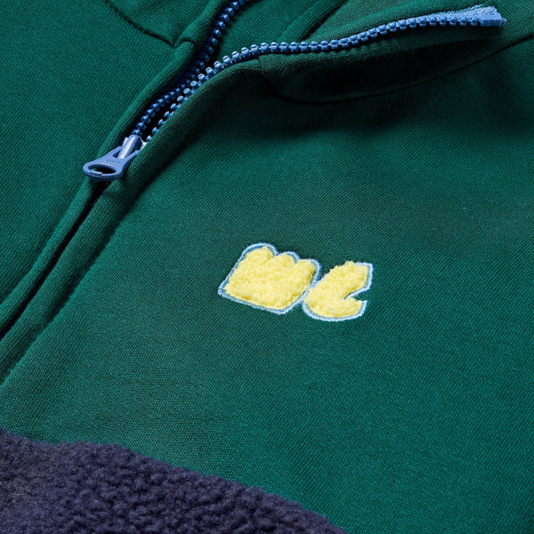 Close-up of Mon Coeur Navy Sherpa Zip Up plush sherpa texture in navy and green colourblock