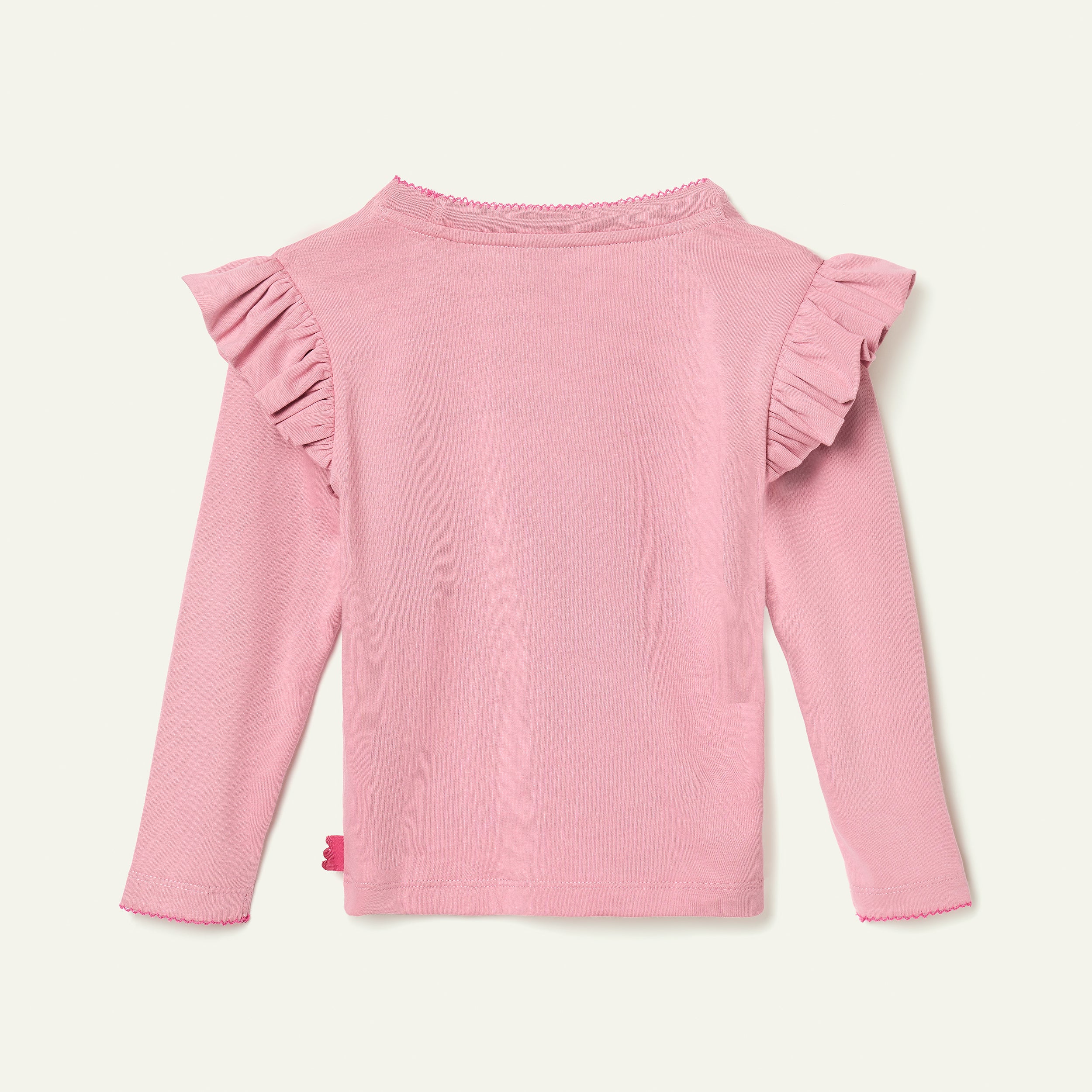 Pink long-sleeve top with ruffled shoulders on a light gray background