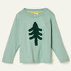 Child wearing the Mon Coeur Snowy Pine long-sleeve T-shirt with boucle embroidered pine tree detail, front view