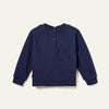 Navy blue sweater on a light beige background