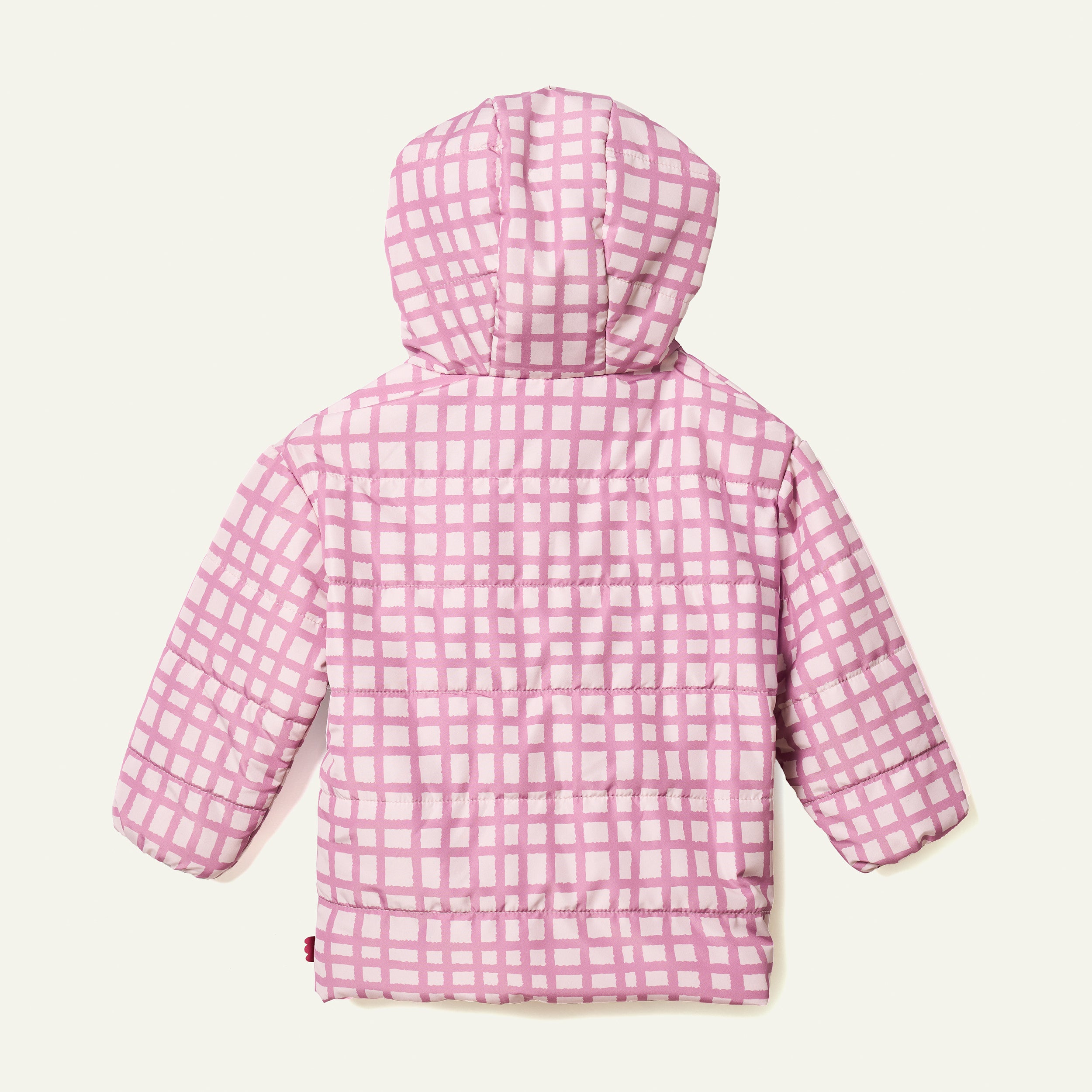 Side view of child in Mon Coeur Pink Grid Puffer jacket, lightweight kids' outerwear in recycled polyester