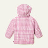 Side view of child in Mon Coeur Pink Grid Puffer jacket, lightweight kids' outerwear in recycled polyester