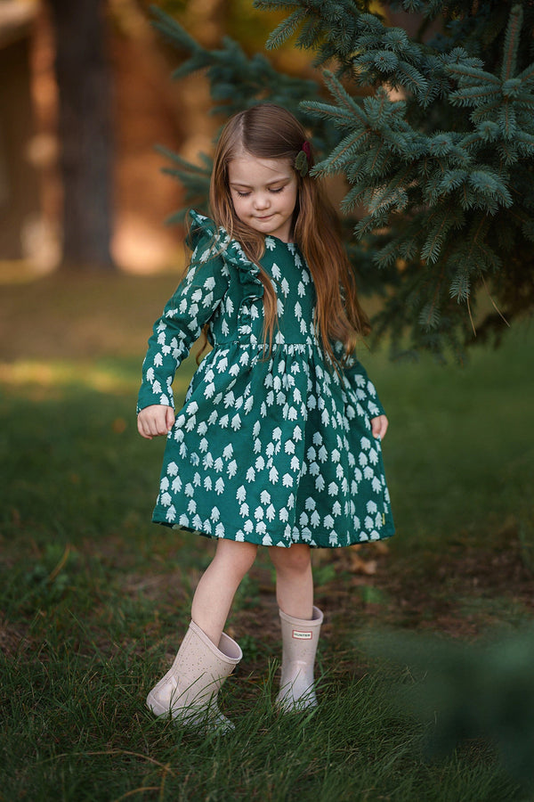 Mon Coeur Snowy Pine Ruffle Dress laid flat, showing full print and A-line silhouette