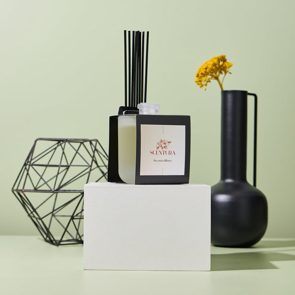 Set of 8oz Aura® diffuser vessels with self-adhesive reed holder wraps displayed together