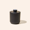 8oz Aura® diffuser bottle alongside matching Aura® candle vessel for a unified product display