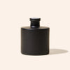 Dream Diffuser Bottle styled on a tabletop as part of a home fragrance display