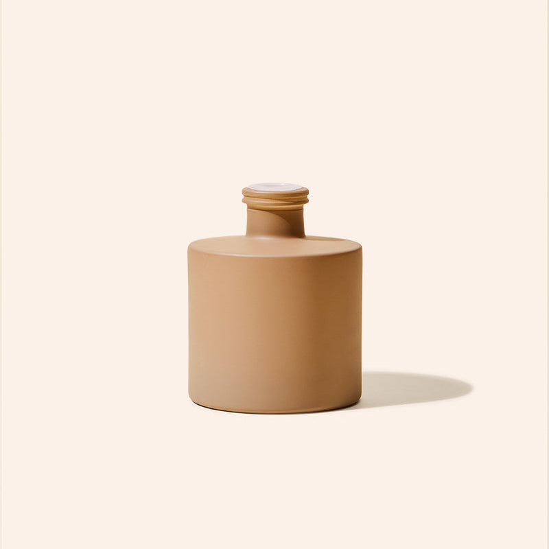 7.5oz Dream Diffuser Bottle paired with matching Dream Candle from the makesy Dream Collection