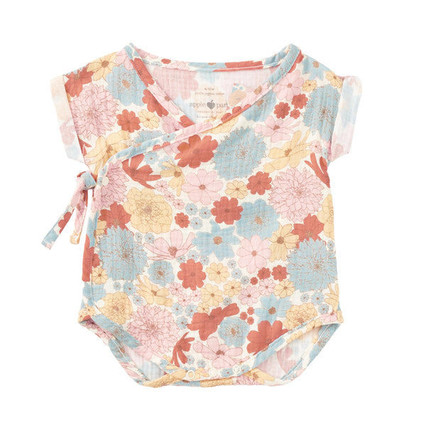 Organic cotton muslin wrap-front baby bubble romper in Wildflower Picnic floral print by Apple Park