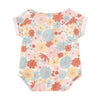 Flat lay of Apple Park organic muslin wrap-front bubble romper in warm-toned Wildflower Picnic print