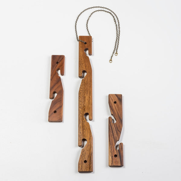 Wooden puzzle hanging on a white background
