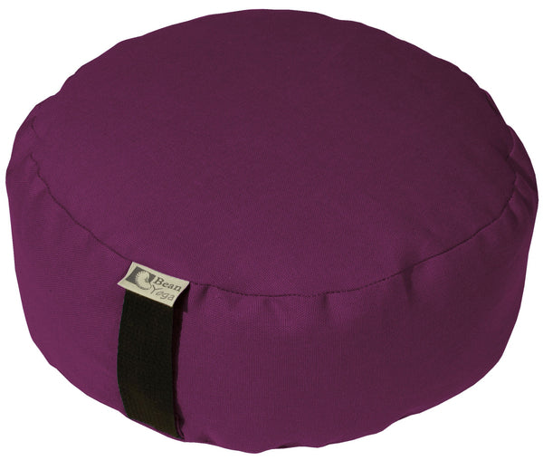 Purple meditation cushion with a brand tag on a white background