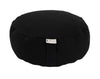 Black meditation cushion with a visible brand label on a white background